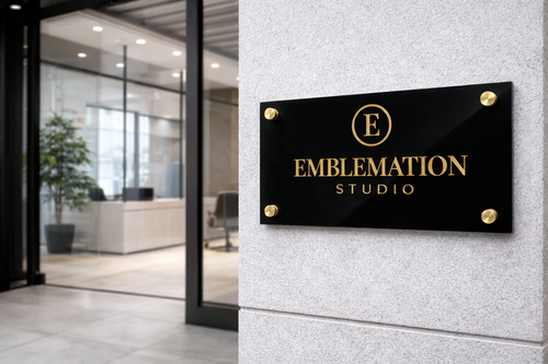 Custom acrylic monogram wall sign displayed in professional office reception area